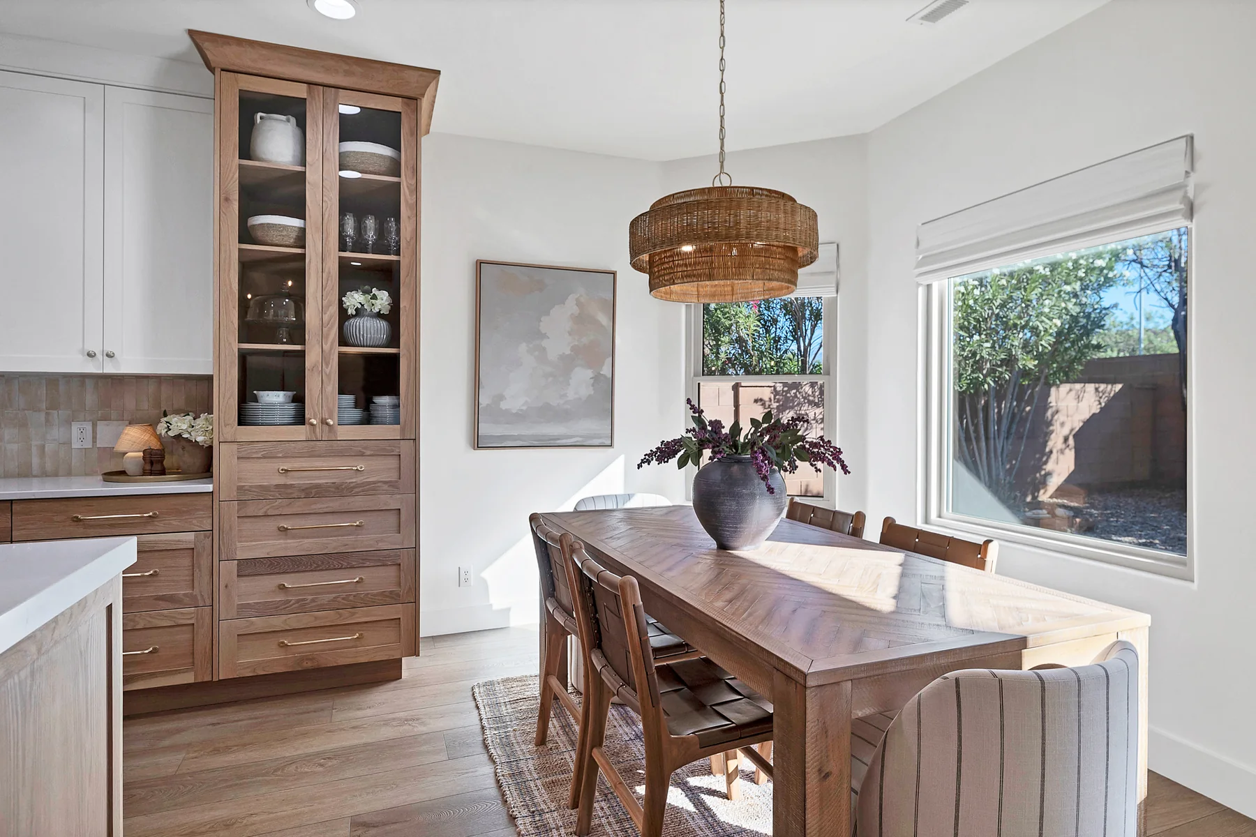 Sunlit dining nook with custom oak hutch