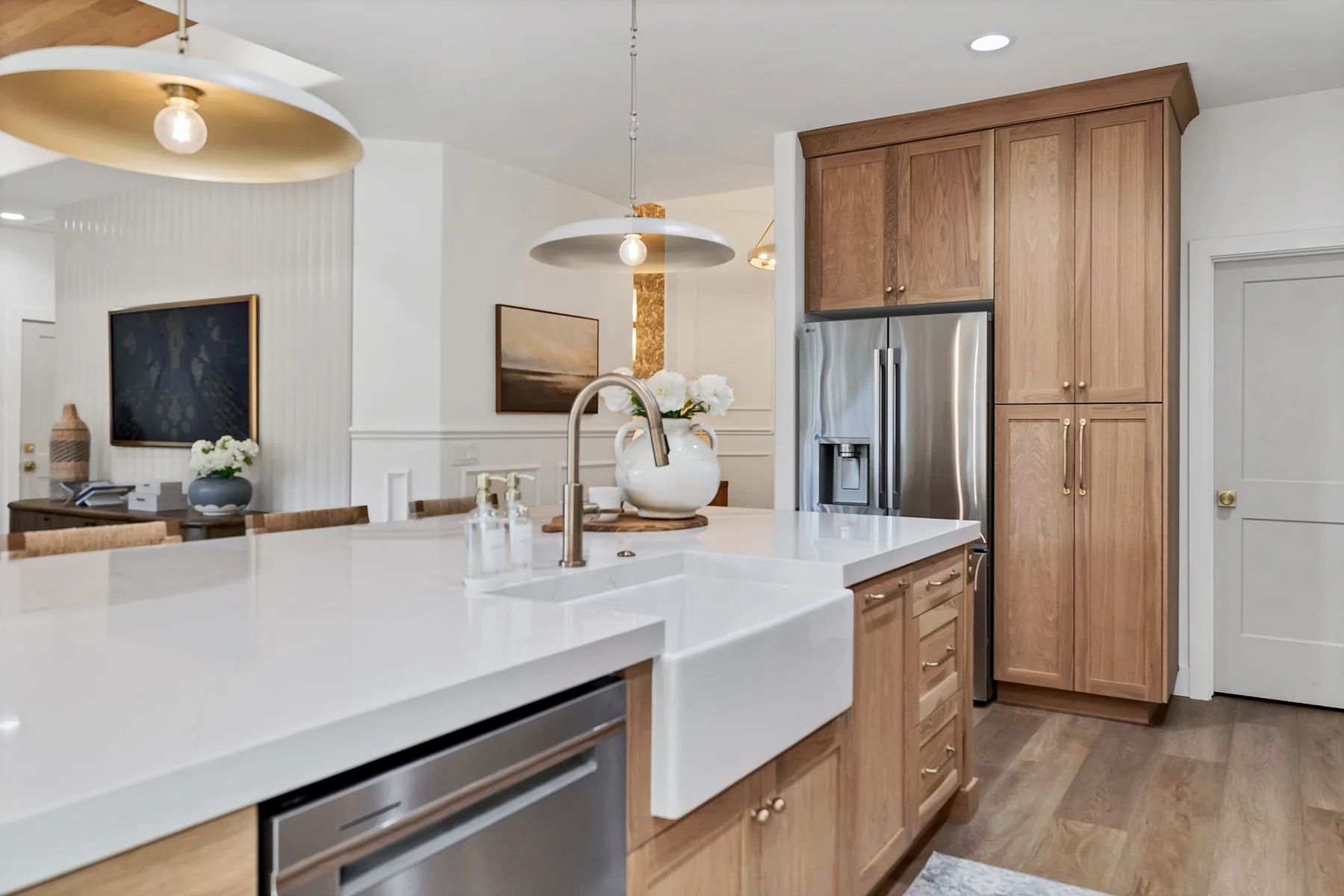 Kitchen sink, paneled refrigerator, and entry beyond