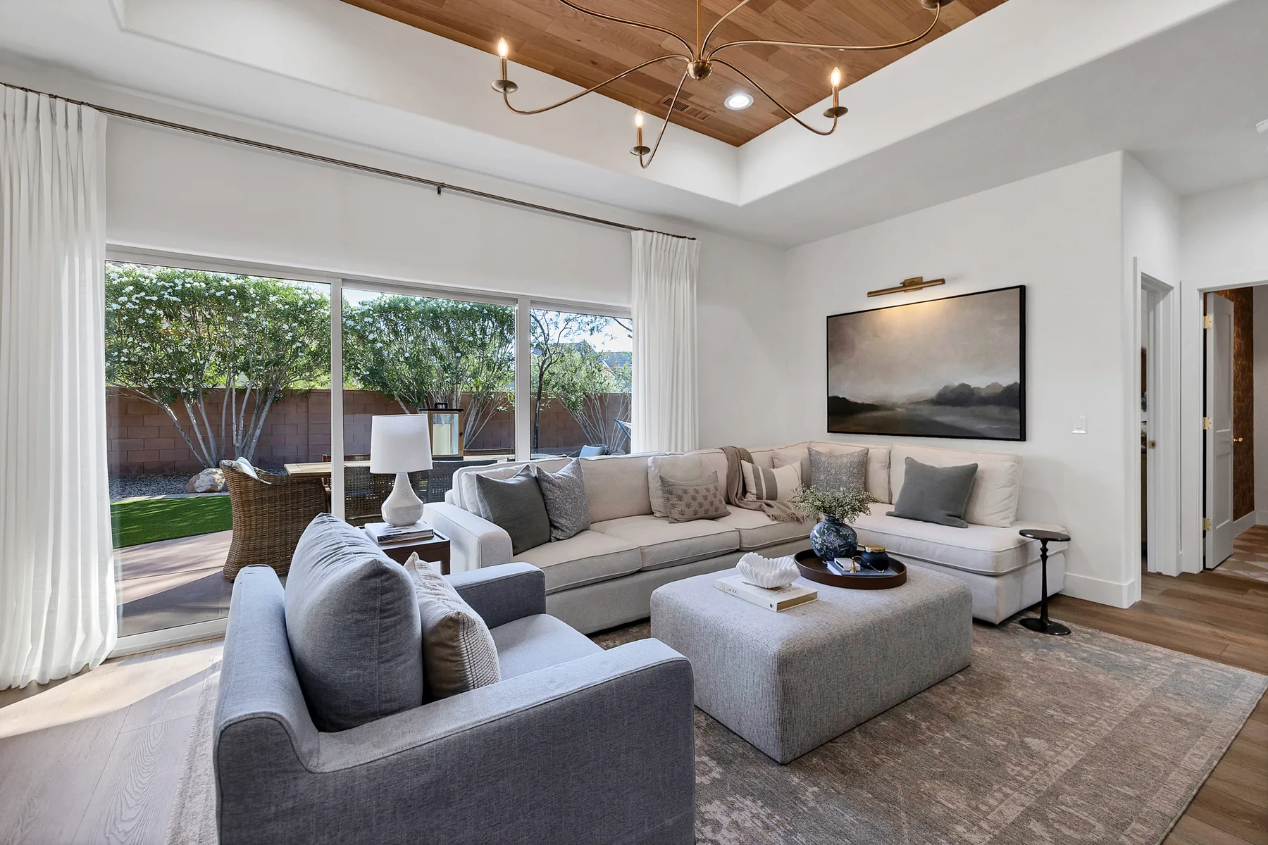 Layered neutral family room with garden views