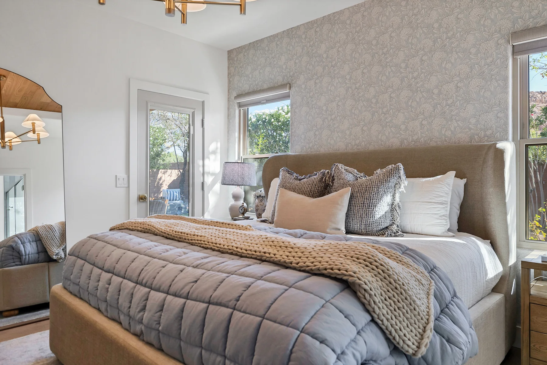 Primary bedroom with layered natural textures